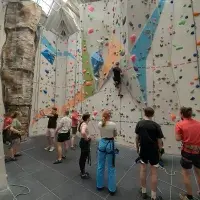 Participants visit a climbing wall. 