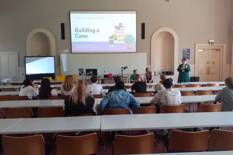 Participants watching a presentation. 